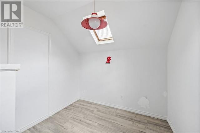Upper Unit - dining space featuring skylight | Image 3