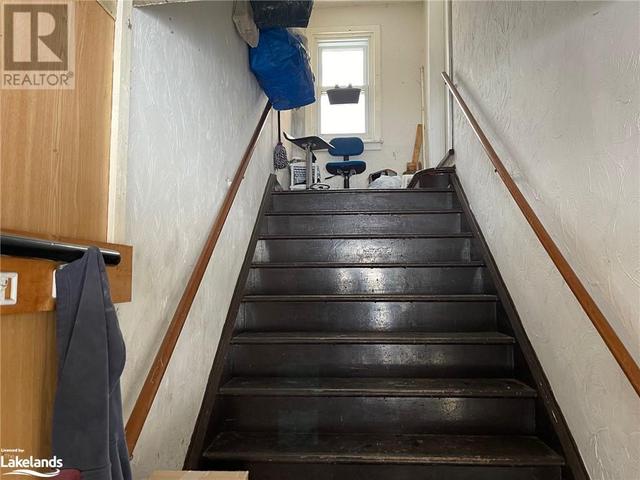 Staircase to upper apt | Image 17