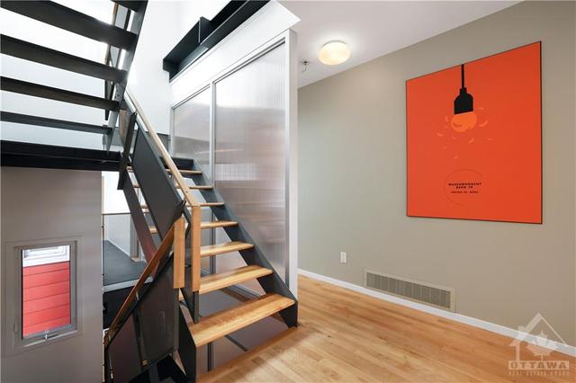 2nd floor landing - Great design providing private bedroom wings. Staircase is central to the design. | Image 17