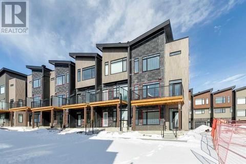 57 Royal Elm Green Nw, House attached with 3 bedrooms, 2 bathrooms and 2 parking in Calgary AB | Card Image