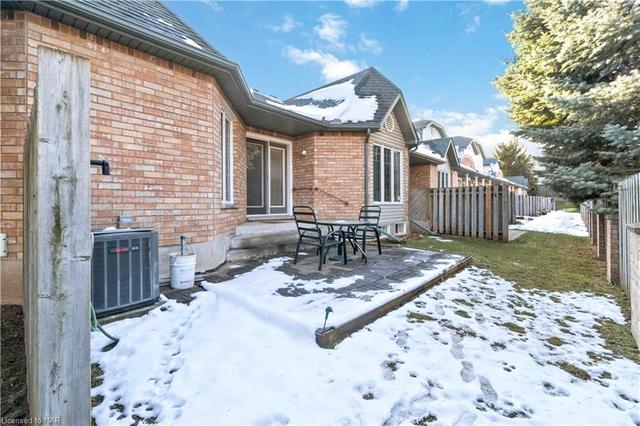 Lets check out the patio - private - plenty of space and lots of green space surrounds this end unit | Image 30