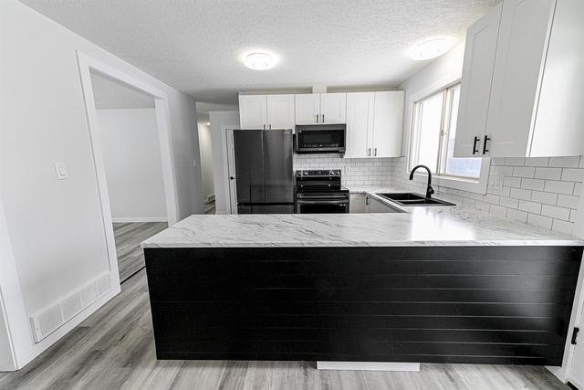 9319 112 Ave, House detached with 5 bedrooms, 2 bathrooms and 5 parking in Grande Prairie AB | Image 13