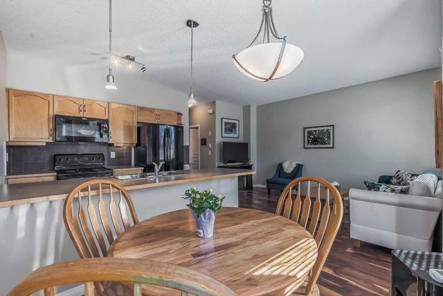 10 Everridge Gardens Sw, Home with 2 bedrooms, 2 bathrooms and 2 parking in Calgary AB | Image 1