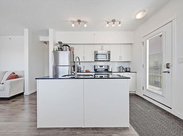 401 - 1740 9th Street Nw, Condo with 2 bedrooms, 1 bathrooms and 1 parking in Calgary AB | Image 1