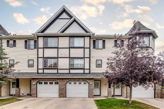 71 Cougar Ridge Mews Sw, Home with 2 bedrooms, 1 bathrooms and 2 parking in Calgary AB | Image 1