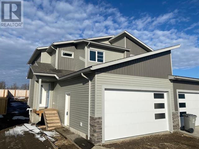 7918 91 Street, House semidetached with 3 bedrooms, 2 bathrooms and 4 parking in Grande Prairie AB | Card Image