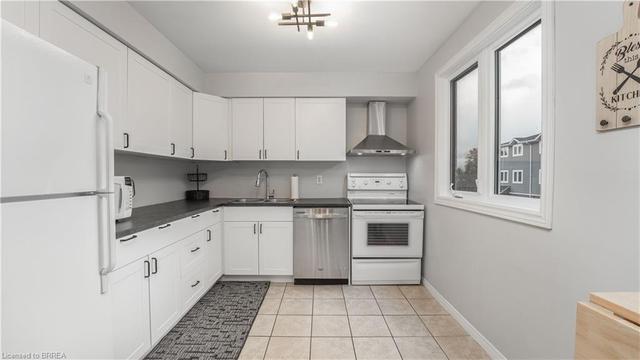 f - 44 Harris Avenue, House attached with 3 bedrooms, 1 bathrooms and 2 parking in Brantford ON | Image 1