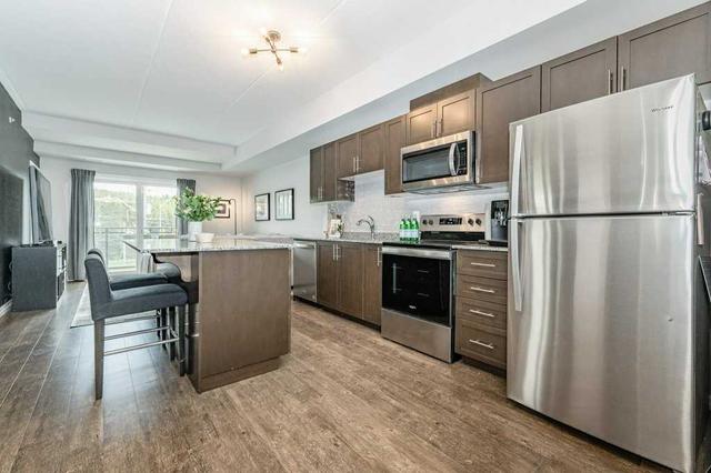308 - 35 Kingsbury Sq, Condo with 2 bedrooms, 2 bathrooms and 1 parking in Guelph ON | Image 2