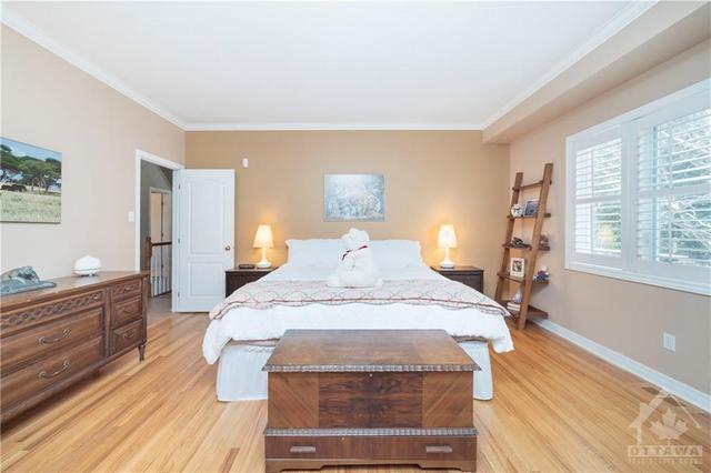 Easily accommodates a king size bed with end tables and dressers/stands/footboard chests, etc. | Image 15
