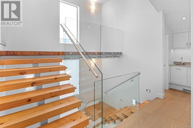 Reclaimed large fir treads, suspended steel stringer stair case| Up to garage & down to kitchen/living level | Image 12
