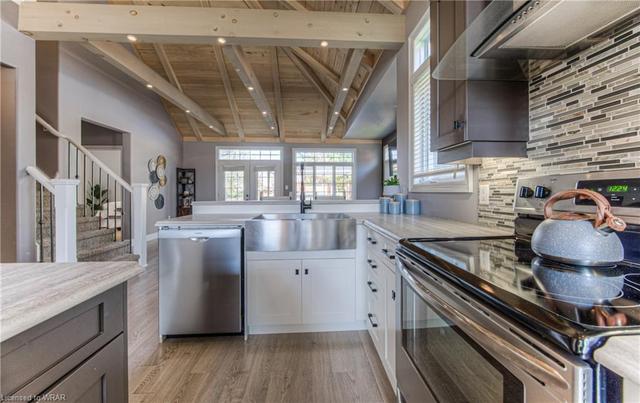 The kitchen is meticulously designed with an apron-front sink and a layout perfect for entertaining. | Image 48