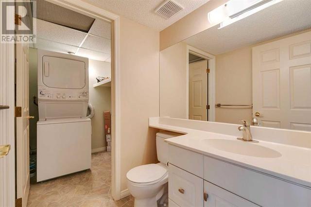 Laundry room with storage | Image 8