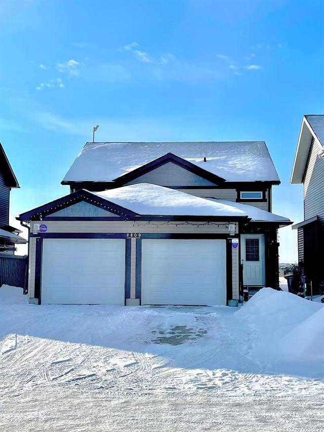 8809 94 Avenue, Home with 5 bedrooms, 2 bathrooms and 4 parking in Grande Prairie AB | Image 1