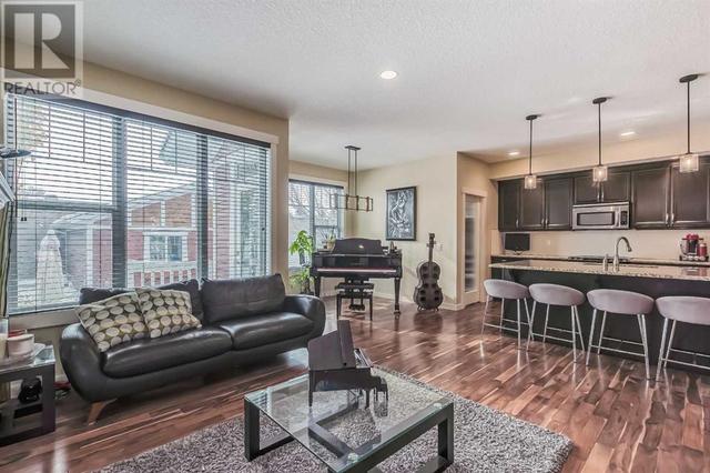128 Mike Ralph Way Sw, House detached with 4 bedrooms, 3 bathrooms and 2 parking in Calgary AB | Image 5