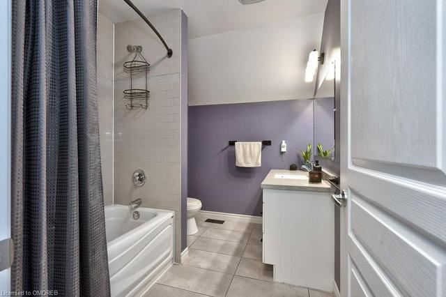 Four-Piece Bathroom Featuring a Granite Countertop | Image 7