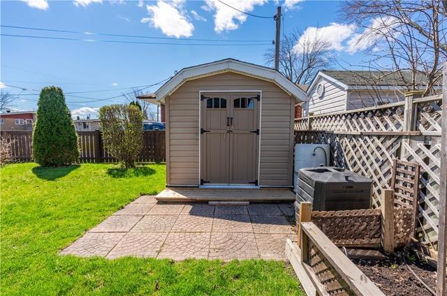 Storage shed and garden area in the rear yard | Image 22