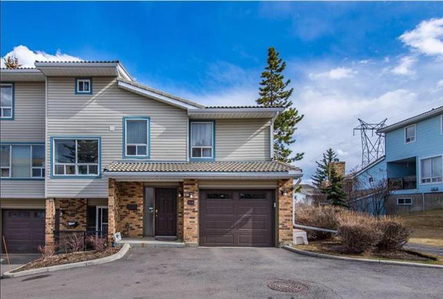 316 Coachway Lane Sw, Home with 3 bedrooms, 2 bathrooms and 2 parking in Calgary AB | Image 1