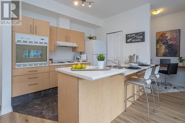 Kitchen with Counter Top Eating Area | Image 6