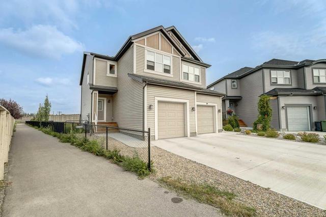 340 Quigley Drive, Home with 4 bedrooms, 3 bathrooms and 2 parking in Cochrane AB | Image 3
