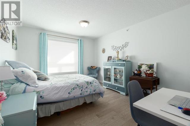 408, - 128 Centre Avenue, Condo with 2 bedrooms, 2 bathrooms and 1 parking in Cochrane AB | Image 23