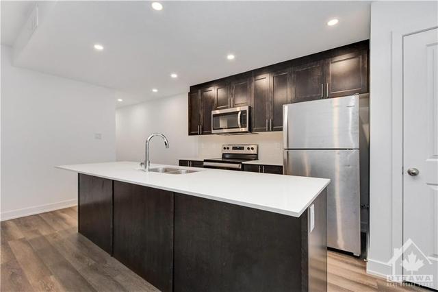 b - 310 Tulum Crescent, House attached with 2 bedrooms, 2 bathrooms and 1 parking in Ottawa ON | Image 9