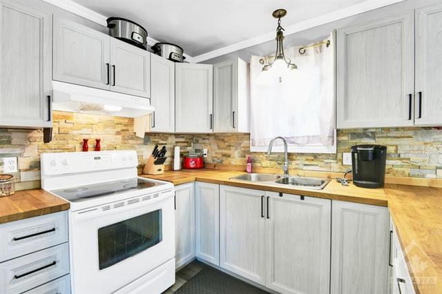 Newer kitchen with butcher block counters for the chef of the family | Image 9