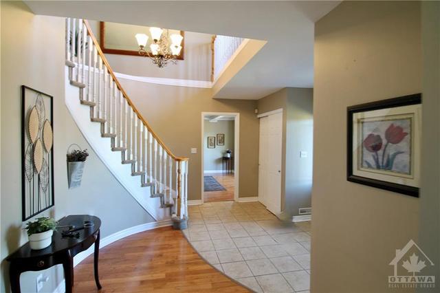 Spacious foyer with curved staircase | Image 3