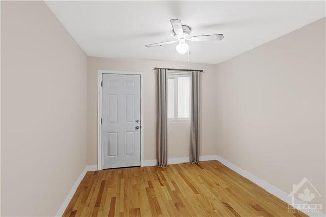 (Virtually Altered)  Main Floor 2 Bedroom Apt- with closet and walkout access to back patio. | Image 11