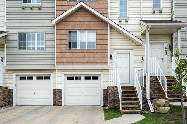 593 Panatella Boulevard Nw, Home with 3 bedrooms, 1 bathrooms and 2 parking in Calgary AB | Image 2