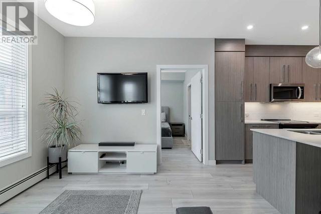 205, - 383 Smith Street Nw, Condo with 2 bedrooms, 2 bathrooms and 1 parking in Calgary AB | Image 11