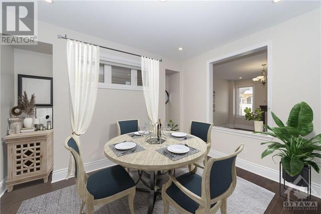Virtually staged as dining room does not include curtain rod, hardware, or drapes. | Image 5