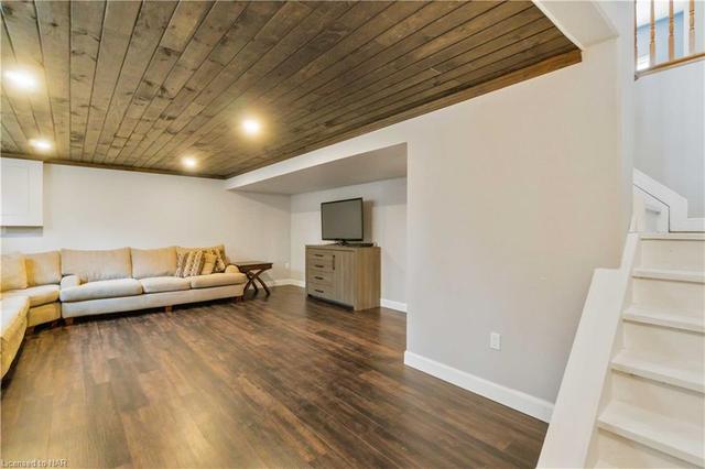 Here is the bottom of the stairs view of the Family Room - enough space for your family? | Image 21