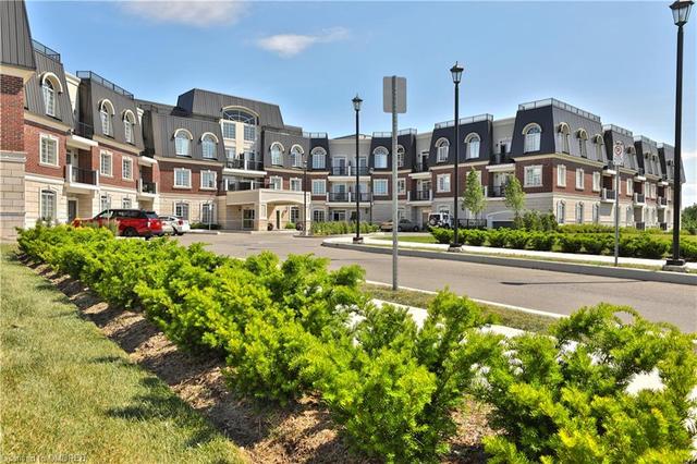 306 - 2300 Upper Middle Road, House attached with 1 bedrooms, 1 bathrooms and 1 parking in Oakville ON | Image 2