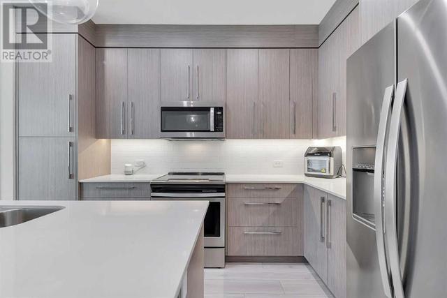 205, - 383 Smith Street Nw, Condo with 2 bedrooms, 2 bathrooms and 1 parking in Calgary AB | Image 6