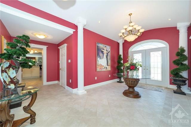 Welcoming entrance way separates the two wings of the home. | Image 2