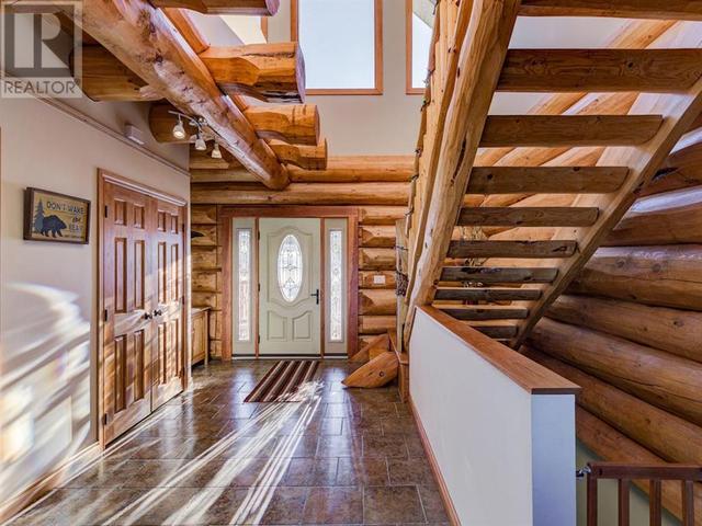 Beautiful Foyer with light from above and an open-riser stair | Image 18