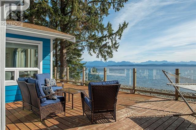 main house deck with water view | Image 1
