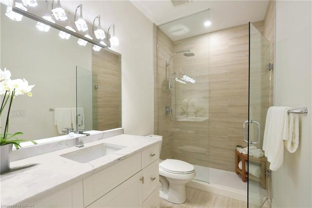 Upgraded shower fixtures in bathrooms and coni marble shower bases; jetted tub in ensuite bathroom | Image 39