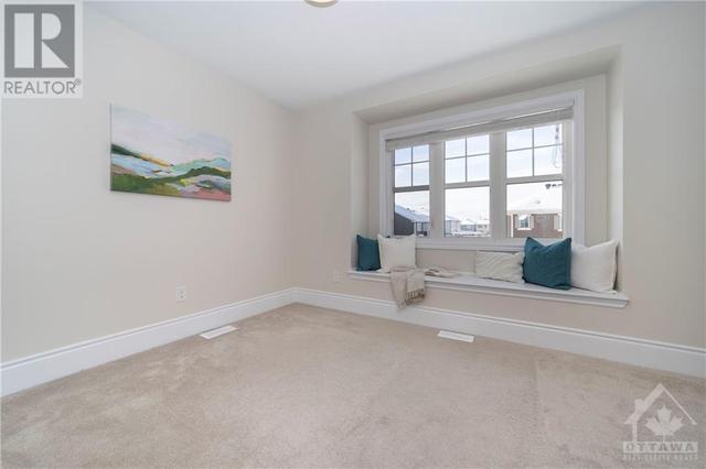Third bedroom at the front of the home features a large window sitting area! | Image 30