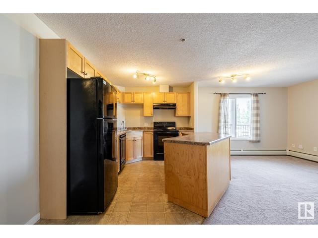 104 - 111 Edwards Dr Sw, Condo with 2 bedrooms, 2 bathrooms and null parking in Edmonton AB | Image 4