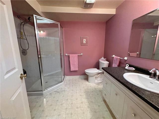 This bathroom is also a good size and offers a convenient walk-in shower. | Image 28