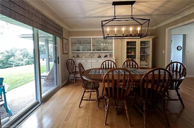 Patio doors int he dining room lead to covered patio with river views. | Image 18