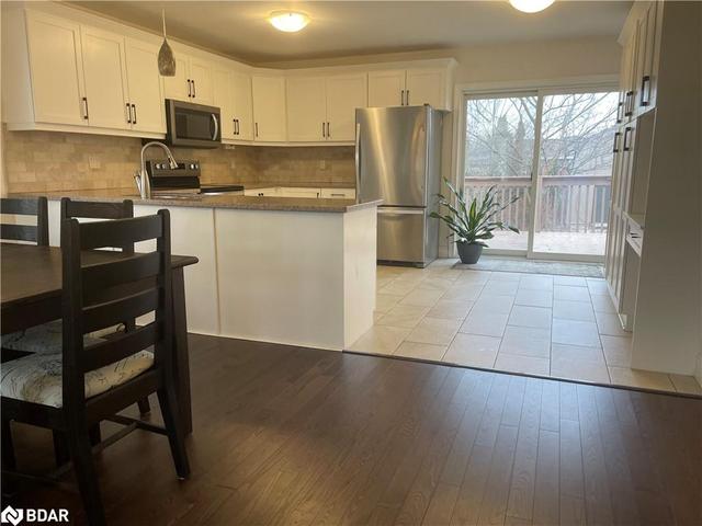 Kitchen has patio doors to deck | Image 34