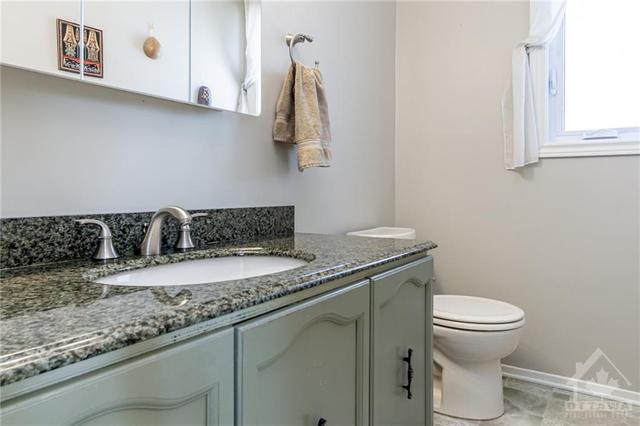 2pc. bathroom at front door also updated | Image 10