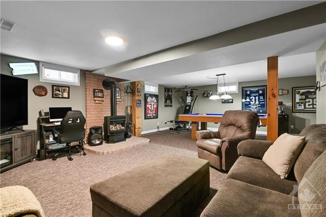Basement Living Space with Fire Place | Image 26