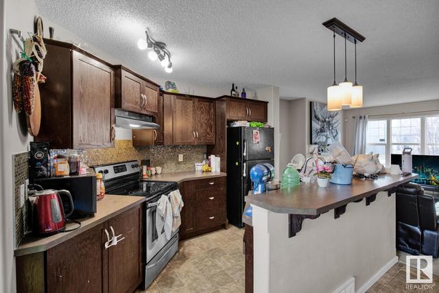 2115 32 St Nw, House semidetached with 4 bedrooms, 2 bathrooms and 2 parking in Edmonton AB | Image 5
