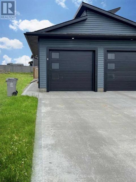 12805 103a Street, Home with 3 bedrooms, 2 bathrooms and null parking in Grande Prairie AB | Card Image