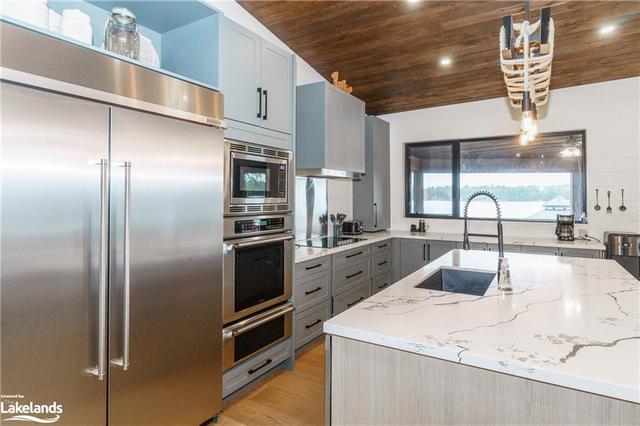 The Island Unit has a counter top with its own river system. | Image 11