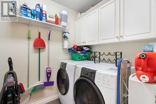 large in-suite storage & laundry room | Image 17