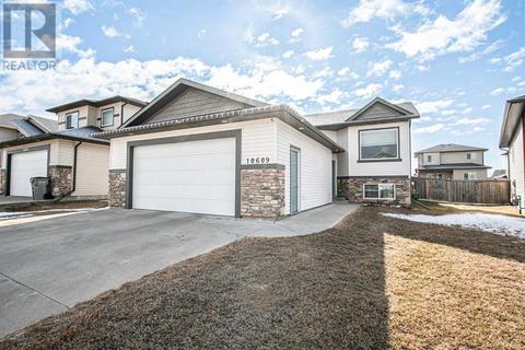 10609 129 Avenue, House detached with 4 bedrooms, 3 bathrooms and 4 parking in Grande Prairie AB | Card Image